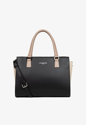 Sac à main noir et beige en matériau synthétique lisse, doté de deux poignées, d'une bandoulière amovible et d'un logo métallique simple.