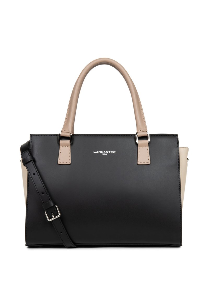 Sac à main noir et beige en matériau synthétique lisse, doté de deux poignées, d'une bandoulière amovible et d'un logo métallique simple.