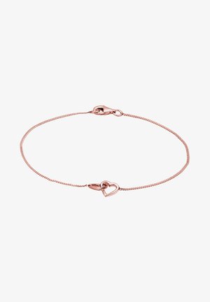 Bracelet en or rose avec une chaîne fine, présentant un accent en forme de cœur et un fermoir clic-clac. Texture lisse avec un design délicat.