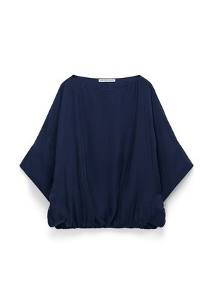 Haut bleu marine, ample, avec des manches larges et un ourlet froncé. Confectionné dans un tissu léger et lisse, au toucher doux.