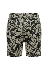 Pantalones cortos de tejido con una superficie texturizada, que presentan un diseño floral abstracto en negro sobre un fondo beige claro. Longitud corta y cinturilla elástica.