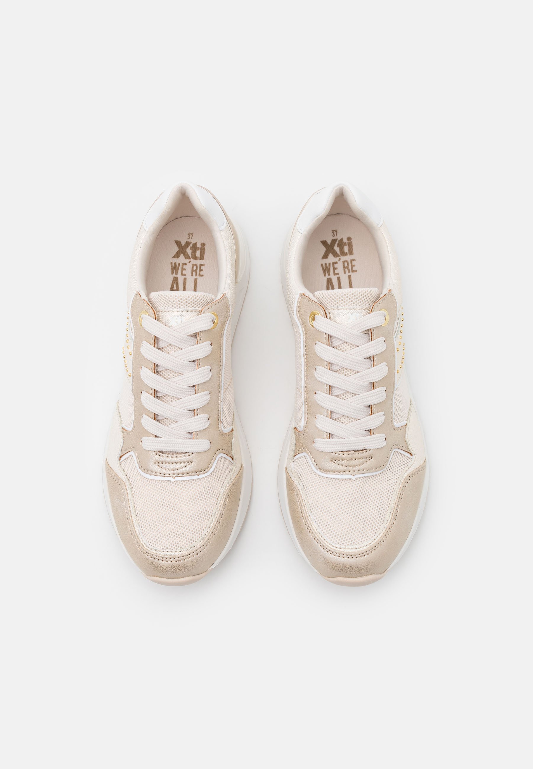 xti gold trainers