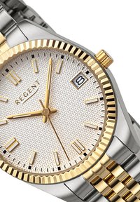 Montre en acier inoxydable argent et or avec un cadran argent texturé, des accents dorés, un affichage de la date et une lunette cannelée. Dispose de marqueurs d'heure lumineux.