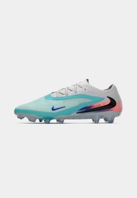 Nike soccer cleat featuring a light gray upper with aqua accents, textured pattern, black and red logos, and a translucent sole.