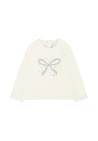 Top a maniche lunghe color crema con una grafica di un fiocco argento e stelle, dotato di scollatura rotonda e chiusura a bottoni sul retro.