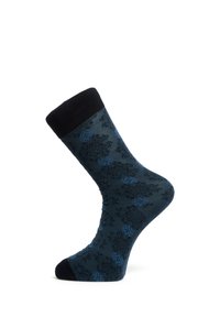 Chaussette bleu foncé avec motif floral noir et bleu clair, bordure, talon et pointe noirs, présentée sur une forme en forme de pied.