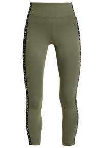 Olivi vihreät legginsit, jotka on valmistettu joustavasta kankaasta, mustilla sivujuovilla, joissa lukee "NIKE AIR". Muotoiltu malli korkealla vyötäröllä.