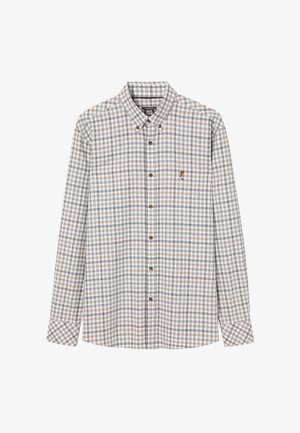 Beige és barna kockás, hosszú ujjú ing, gombos gallérral, fából készült gombokkal, és egy kis hímzett logóval a mellkason.