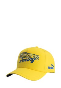 Żółta czapka z niebieskim napisem "Williams Racing", z wygiętym daszkiem, gładką fakturą i logo Puma na boku.