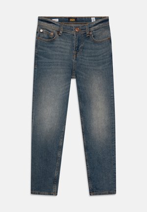 Jeans en denim bleu avec poches avant, fermeture par boutons, légère décoloration au niveau des cuisses et étiquette de marque à l'intérieur de la ceinture.