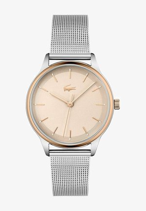 Silvrigt meshband armbandsur med en roséguld bezel och en ljusbeige texturerad urtavla. Har tunna timmarkörer och logga i mitten.