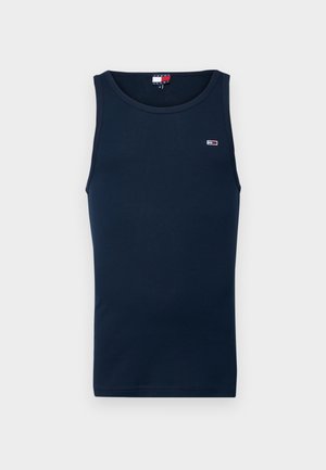 Débardeur bleu marine en coton, avec un col rond et un petit logo sur la poitrine. Texture lisse et coupe ajustée.