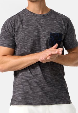 Gray, short-sleeve T-shirt with a textured fabric and a dark patterned pocket. The design features subtle striped detailing.