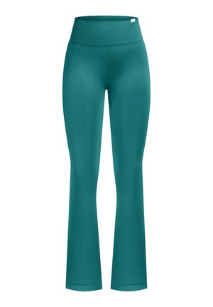 Turkise vide yogabukser i elastisk stof med høj talje og glat tekstur, designet til komfort og bevægelse.