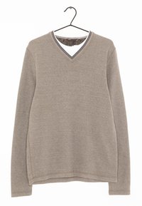 Beige V-halset sweater lavet af blødt stof. Har lange ærmer og en tekstureret krave med et diskret mønster indeni.