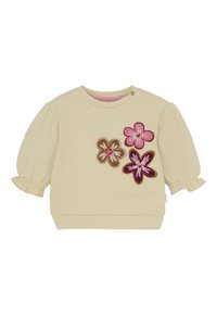Kremowa koszulka dla małego dziecka z długim rękawem, z bufiastymi rękawami i trzema haftowanymi kwiatkami w kolorze różowym, fioletowym i oliwkowym z przodu po prawej stronie.