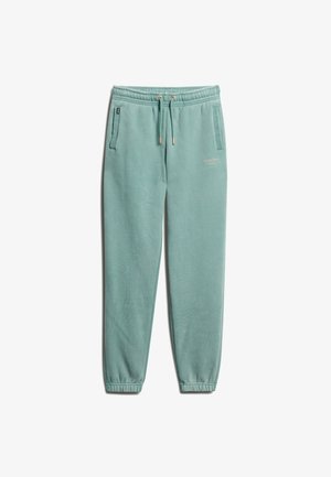 Pantalons de jogging vert clair avec taille élastique, cordon de serrage, poches latérales et poignets côtelés. Logo de la marque discret à l'avant.