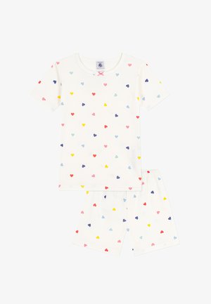 Completo composto da una maglietta a maniche corte bianca e pantaloni corti, decorato con piccoli cuori multicolori e un piccolo fiocco rosa nel colletto.