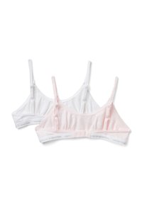 Dos bralettes en blanco y rosa claro, hechas de algodón suave, con tirantes ajustables y una banda con el logotipo en la parte inferior.