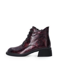 Lace-up ankle boots in burgundy cracked leather with a textured finish, a rounded toe, and a low, chunky black heel.