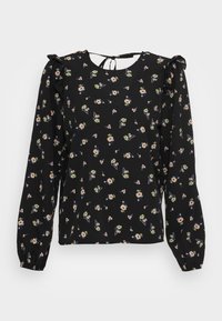 Blusa nera con maniche lunghe, motivo floreale in colori pastello, scollatura arrotondata e dettagli con volant sulle spalle, chiusa con un fiocco sulla schiena.