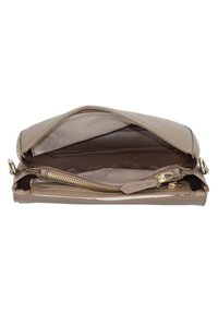 Tan handbag with a smooth leather exterior, featuring a zippered compartment and interior pocket, accented with gold-tone hardware.