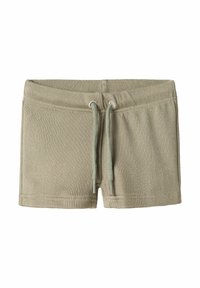 Ljust gröna ribbade shorts med elastisk midja och dragsko, med en mjuk textur och en minimalistisk design.