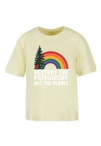 Light yellow cotton t-shirt featuring a rainbow graphic in multiple colors and trees, with the text "DESTROY THE PATRIARCHY NOT THE PLANET."
