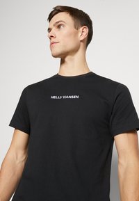 Helly Hansen CORE GRAPHIC - Triko s potiskem - black