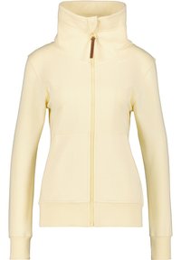 Chaqueta de cremoso color claro, de manga larga y con cremallera, con cuello alto, bolsillos frontales y puños y dobladillo acanalados, desabrochada hasta la mitad.