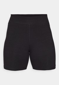 Pantaloni corti neri elasticizzati con un alto punto vita, caratterizzati da cuciture piatte e una texture liscia, progettati per il comfort e la flessibilità.