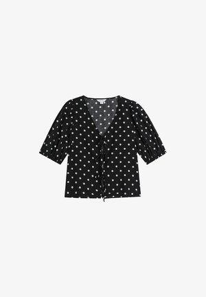 Mustat puserot, joissa on valkoisia pilkkuja, lyhyet puffihihat, V-mallinen kaula-aukko ja edessä solmittava sulkija, kevyestä kankaan rakenteesta.