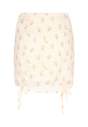Kremowa mini spódniczka z małym wzorem żółtych róż, teksturowaną tkaniną i regulowanymi sznureczkami u dołu po obu stronach.