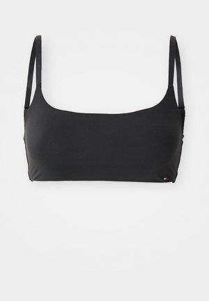Zwarte bikini top met verstelbare bandjes, gladde stof, rechthoekige vorm en een klein logoaccent aan de zijkant.