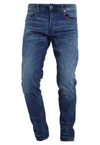 Slim fit jeans i mörkblå denim, med en klassisk fem-fickorsdesign och subtila slitningar framtill.