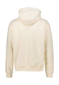 Felpa color crema, realizzata in tessuto morbido. Presenta un cappuccio, polsini e orlo a costine. Texture liscia senza motivi o grafiche visibili.