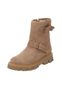 Tan mockasinkänga med två justerbara remmar, rund tå och en kraftig gummisula med ett texturerat mönster.