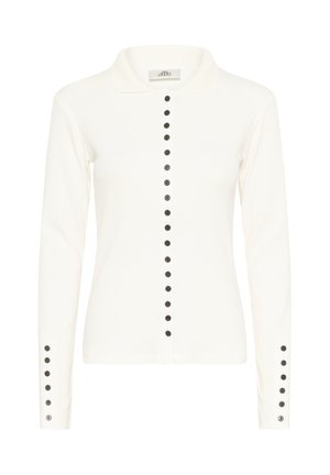 Camisa blanca de manga larga con cuello y una fila vertical de botones negros en el frente y en los puños.