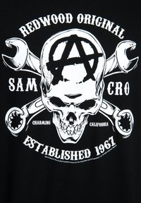 Black t-shirt featuring a white graphic design of a skull, crossed wrenches, and text: "Redwood Original", "SAMCRO", and "Established 1967".