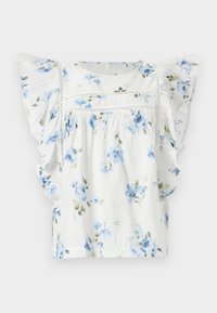 Blusa floreale bianca con fiori blu, maniche corte a volant e delicati dettagli in pizzo sul petto. Tessuto leggero.