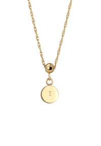 Gold necklace featuring a twisted chain, round pendant with engraved markings, and a spherical link near the pendant.