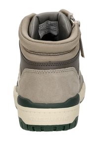 High-top sneaker featuring a gray suede upper, beige textile accents, a green rubber outsole, and a padded collar with pull tab.