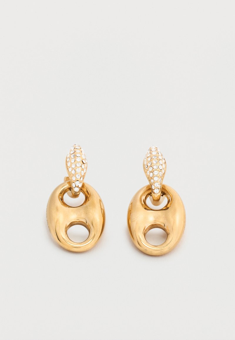 Σκουλαρίκια οβάλ σε χρυσαφένιο τόνο με μικρό κυκλικό άνοιγμα και σταυρωτά μαργαριτάρια σε σχήμα σταγόνας πάνω σε ουδέτερο φόντο.