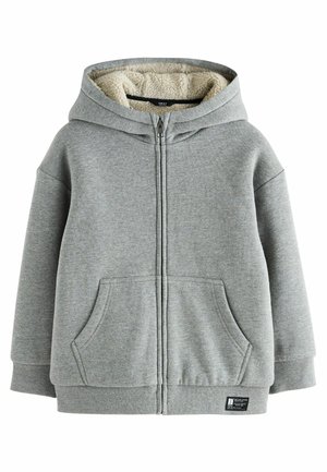 Sweat à capuche zippé gris avec une doublure intérieure en peluche de couleur crème. Dispose de deux poches avant et de poignets et un ourlet côtelés. Matière douce en mélange de coton.