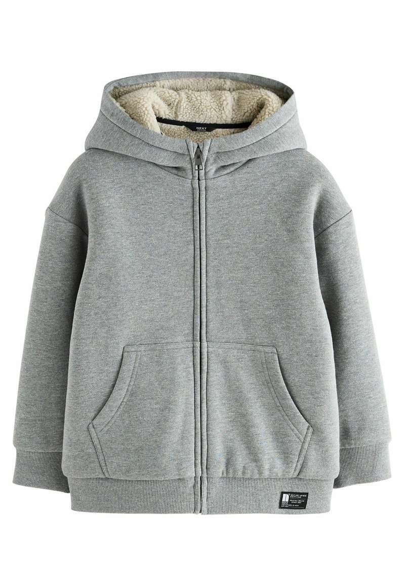 Grå zip-up hoodie med en fluffig, krämfärgad innerfoder. Har två framfickor samt ribbad mudd och nederkant. Mjuk bomullsblandning.