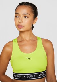 Puma KEEPS BRA - Športni modrček s srednjo podporo - lime pow