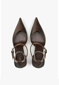Brown satin pointed-toe shoes with a cutout design and ankle strap. Features a silver-tone accent on the strap and a smooth interior.