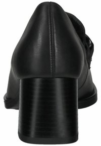 Escarpin noir en cuir lisse, avec un bout arrondi et un talon cylindrique texturé. Design minimaliste sans embellissements.