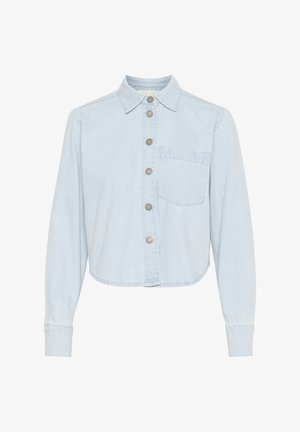 Helehelesin sinine teksajakk, millel on kaelusega kaelus, nööpidega esikülg, pikad varrukad ja üks rinnatasku. Omab lühendatud äärt ja peent tekstuuri.