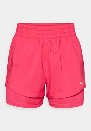 Roosa spordipüksid elastse vöökohtaga, millel on kihiline disain. Materjalid on kerged ja siledad, Nike logo aktsentidega.